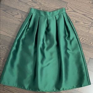 Emerald green satin skirt.